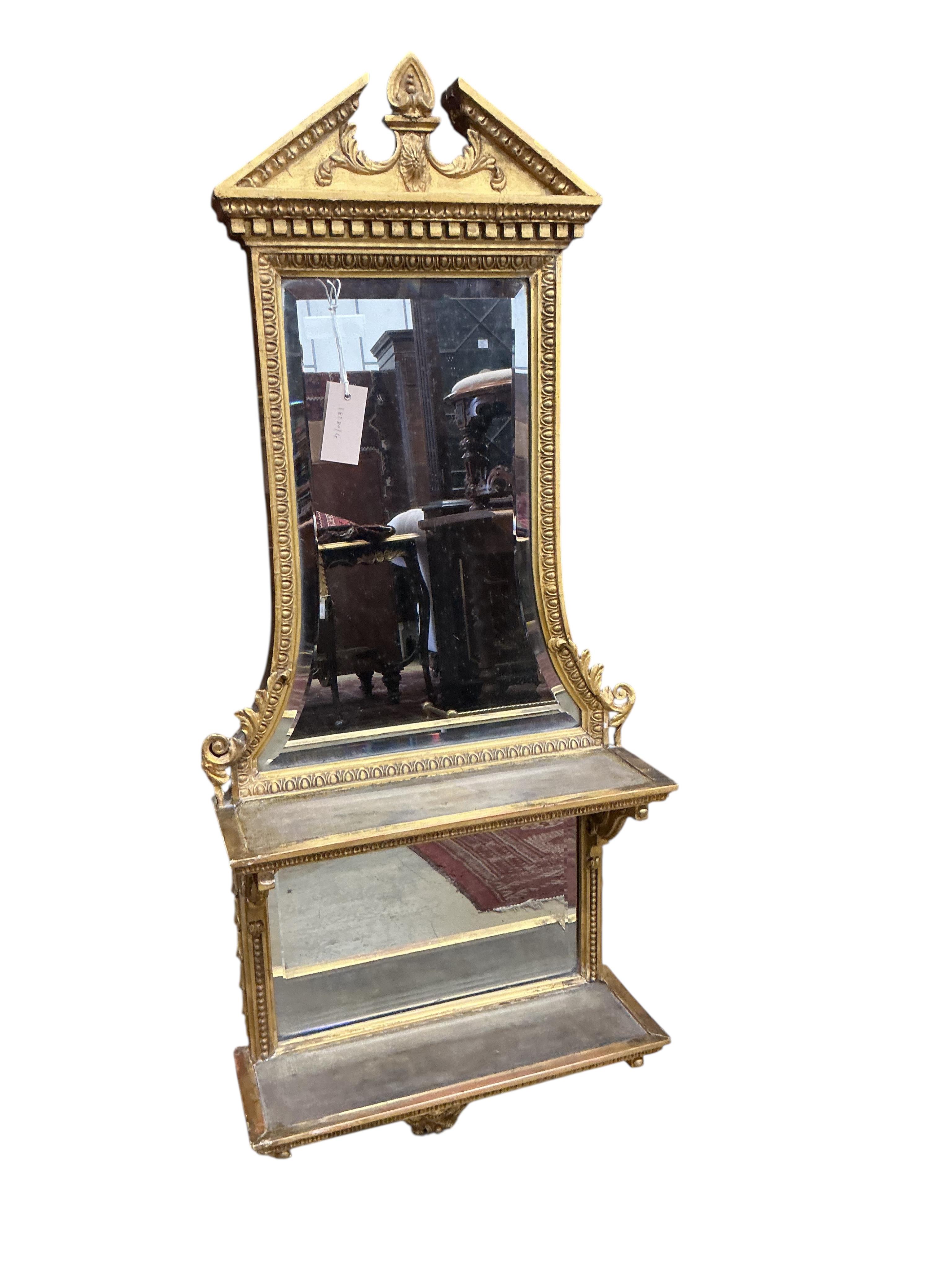 A 19th century giltwood and composition mirrored two tier wall bracket, width 44cm, height 108cm